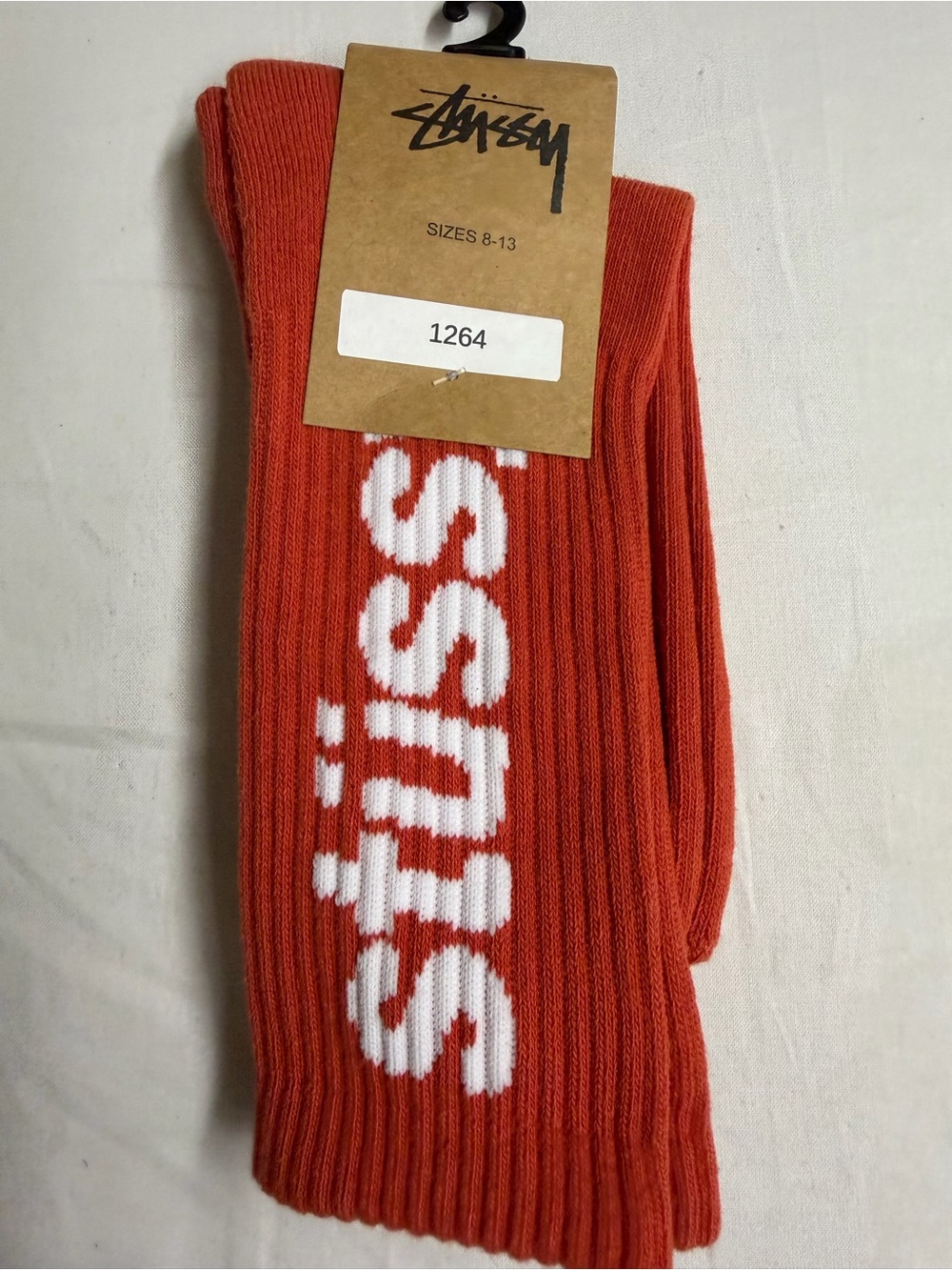 Stussy Men's Ribbed Crew Socks in Orange with White Logo